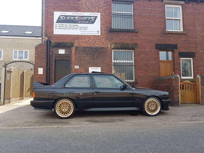 Image shows a BMW E30 M3 parked outside Slick-Shifts shop in Penistone, Sheffield.