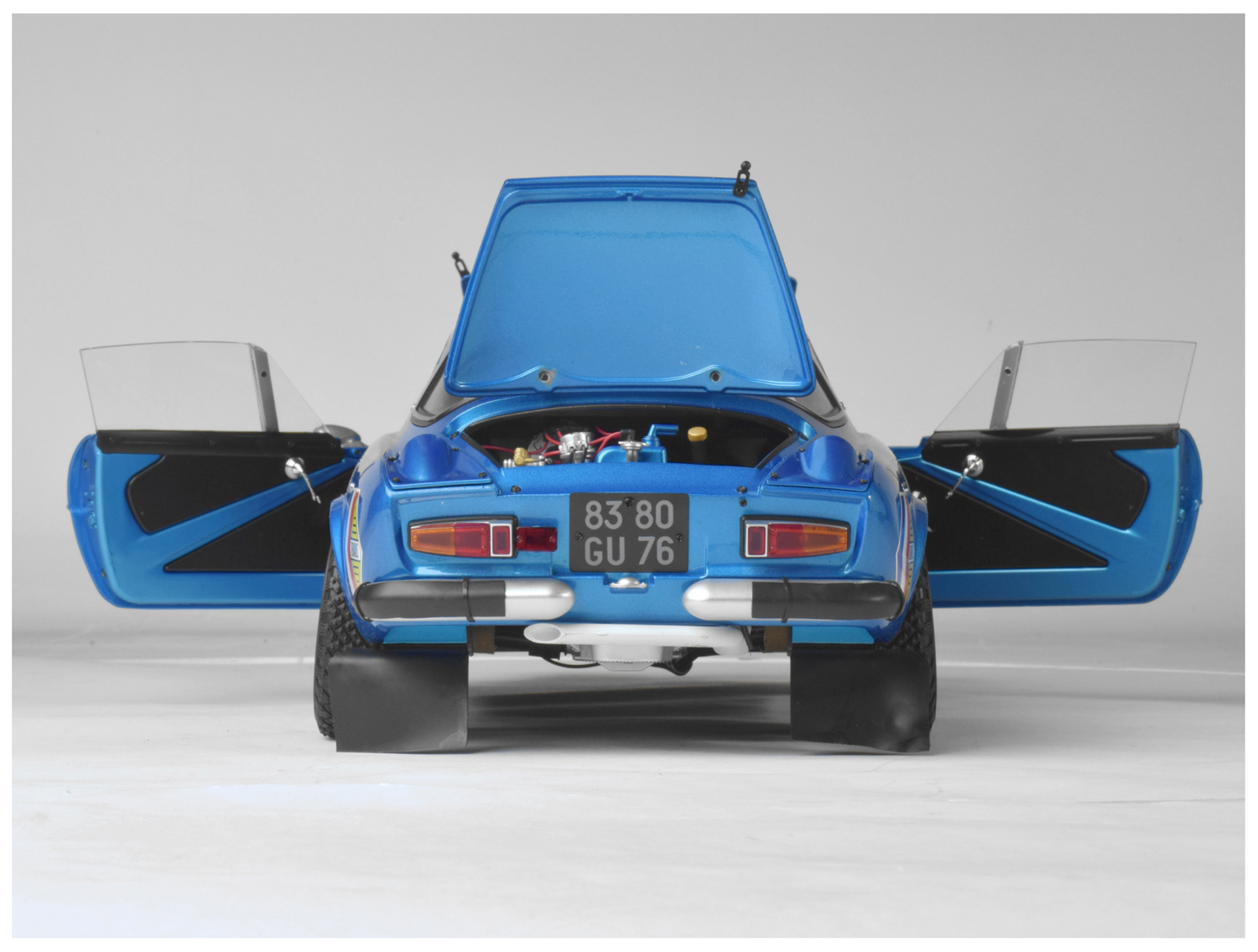 Rear end on shot showing boot & doors open