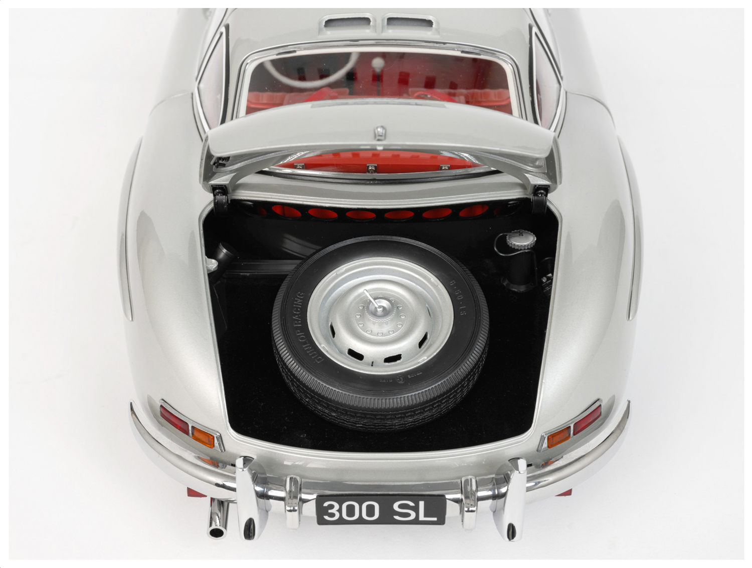 Rear end shot showing boot lid open with spare tyre in boot area