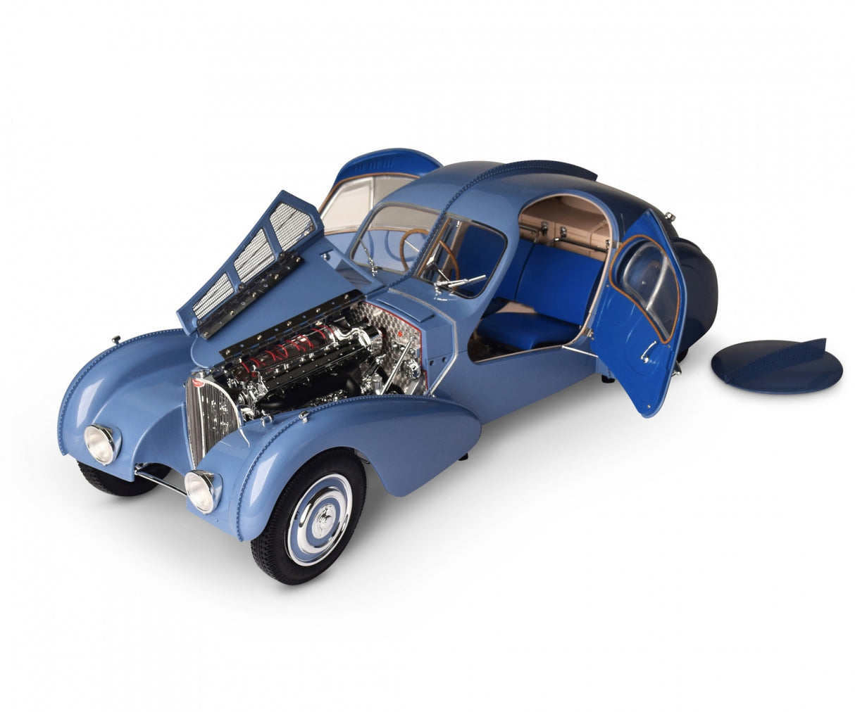 Front angled shot showing both doors and engine bay flap open with spare wheel cover on the floor at the side of the Bugatti
