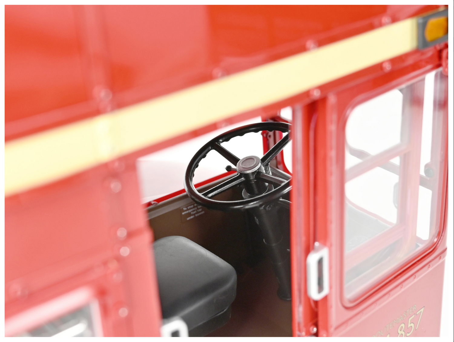 Inside shot through door showing steering wheel and seat